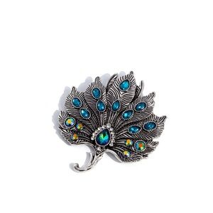 Elegant Silver and Blue Peacock Brooch